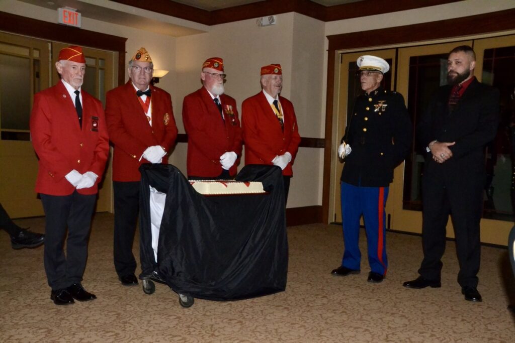MCL Detachment #783 preparing for the ceremonial cake-cutting in the annual birthday ball celebrating the Marine Corps. Photo by Brittany Holbrooks