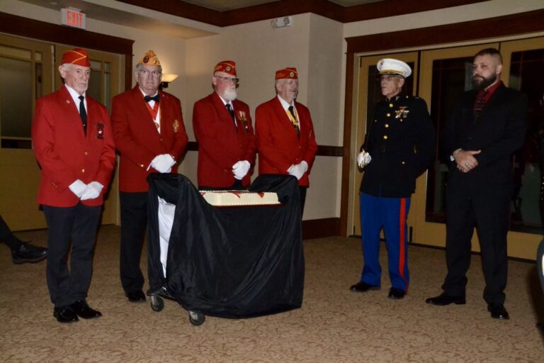 MCL Detachment #783 preparing for the ceremonial cake-cutting in the annual birthday ball celebrating the Marine Corps. Photo by Brittany Holbrooks