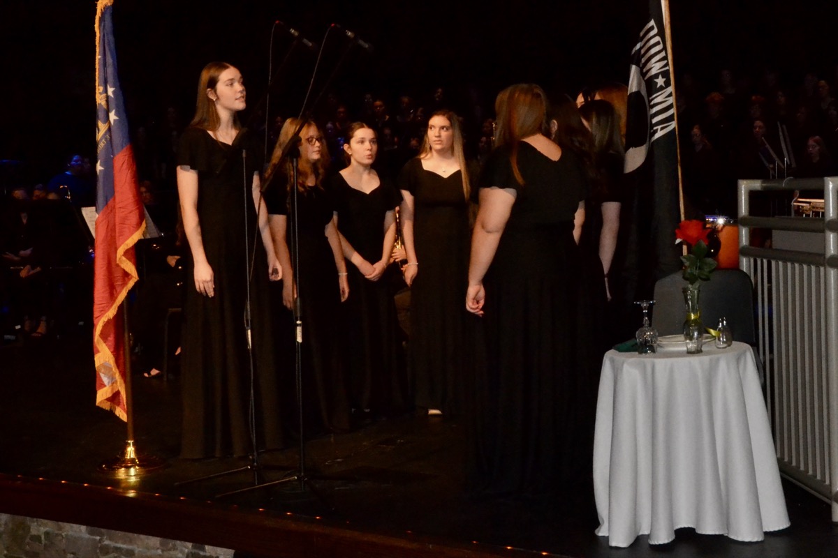 The UCHS Chorus Ensemble moved some audience members to tears with their performance of “Amazing Grace” in honor of those who never came home, recognized here with The Missing Man Table. Photo by Brittany Holbrooks