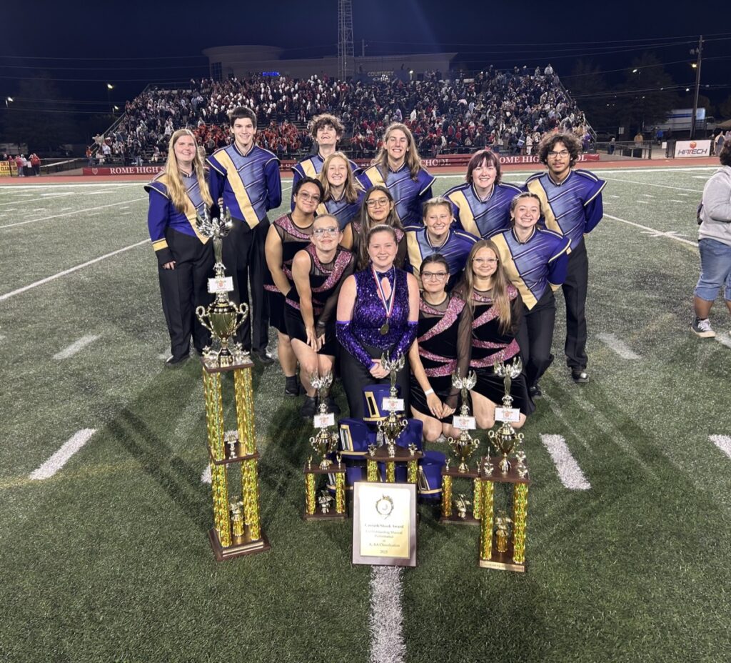 Several thrilled members of the 77-student Union County High School Band celebrating their victorious streak at the Peach State Marching Competition last month. Photo/Submitted