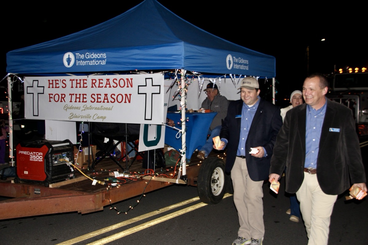 Gideons International Blairsville Camp also highlighted the true reason for the Christmas season by handing children New Testaments – a wholesome addition to the massive amounts of candy collected from other parade floats. Photo by Shawn Jarrard