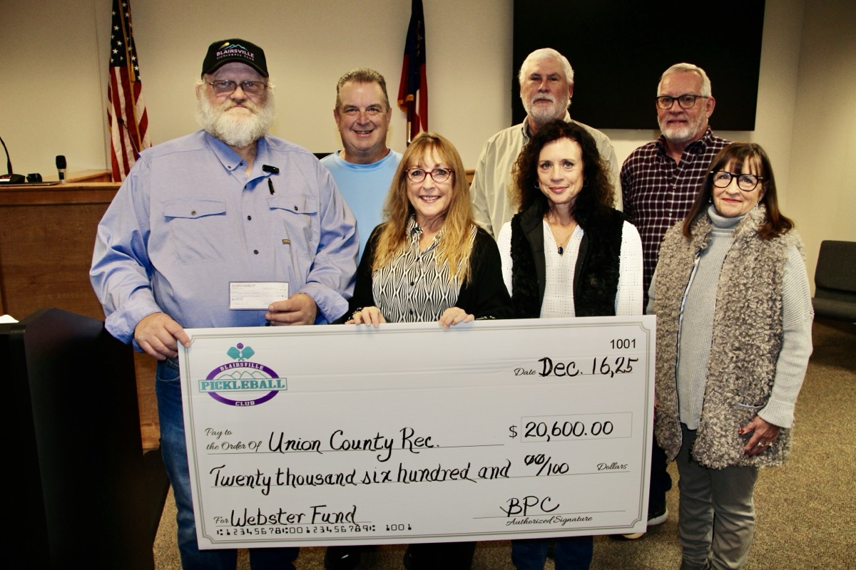 (L-R) Harold Collins with Blairsville Pickleball Club Officers Kevin Sampson, Martina Gibboney, David Campbell, Julia Scodeller, Wayne Tingle and Patty Gaddy, who attended the Dec. 16 county meeting to make a major community donation. Photo by Shawn Jarrard