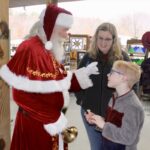 Kris Kringle had a wonderful time speaking with children during his namesake holiday shopping event at the Union County Farmers Market on Saturday, Dec. 6. Photo by Lowell Nicholson