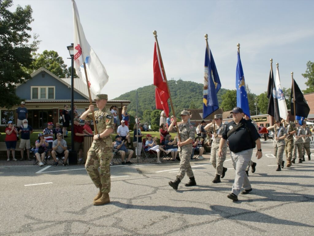 Crowd lines the street for the America 250 Fourth of July parade in downtown Blairsville, Georgia