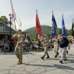 Crowd lines the street for the America 250 Fourth of July parade in downtown Blairsville, Georgia