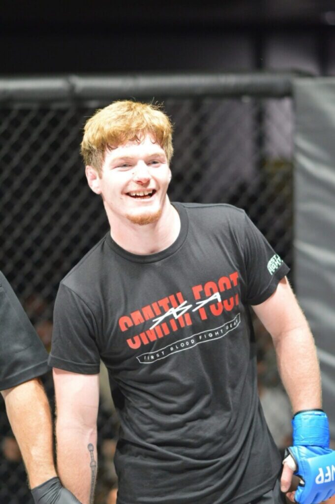 Former Union County wrestler Asa Smith-Foot smiles inside the cage after an amateur MMA bout in Las Vegas