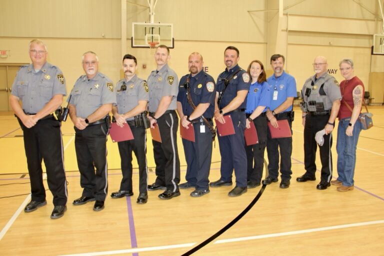 (L-R) Chief Deputy Josh Berry, Sheriff Shawn Dyer, Deputy CJ Townsend, Sgt. Michael Kearns, Fire Lt. Travis Gibson, FF/Paramedic Kyle Mead, AEMT Amber Pruitt, Paramedic Derrick Pruitt, Deputy Buck Stover and Kim Stover. Not pictured: FF Adam Podber. Photo by Shawn Jarrard