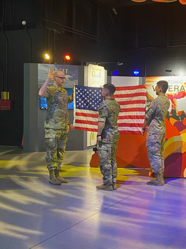 U.S. Army Maj. Andy Friesen, center, has made his hometown proud by receiving a merit-based rank advancement, pictured here at his recent promotion ceremony. Photo/Submitted