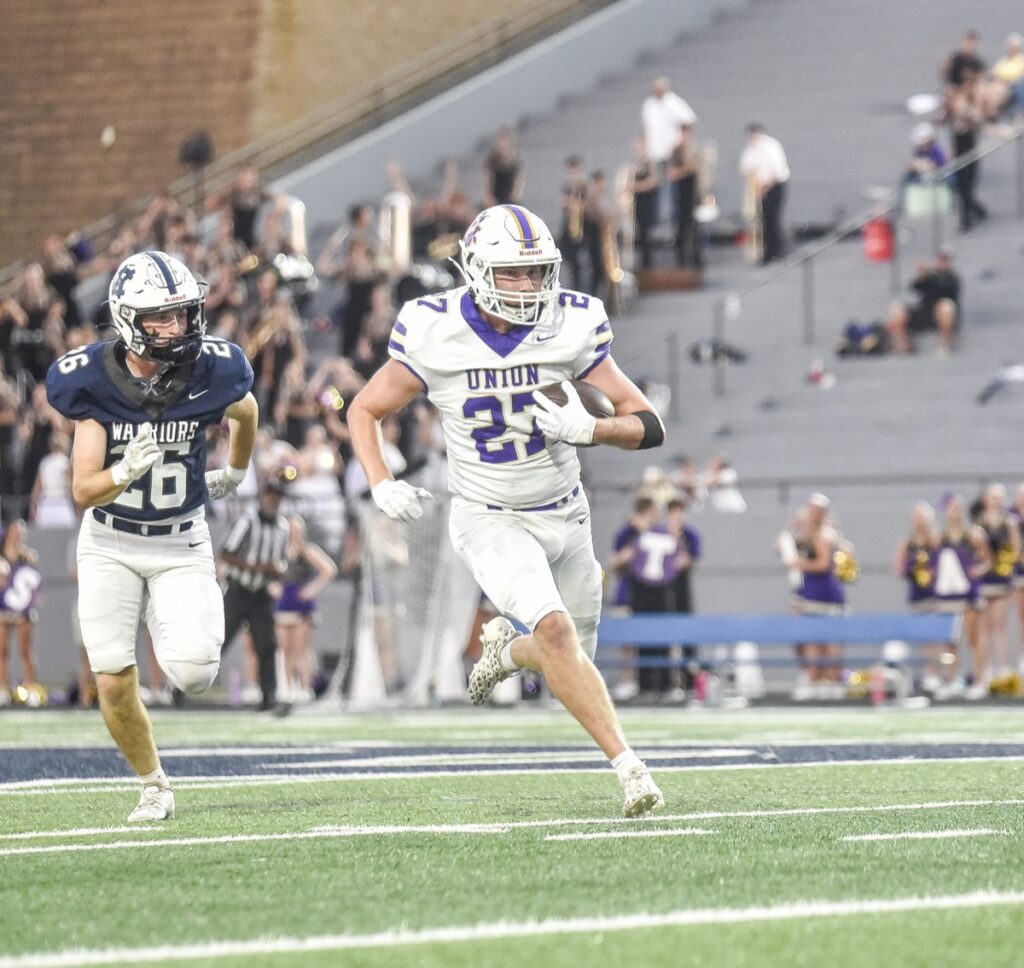 Micah Wallace returns a first-quarter interception