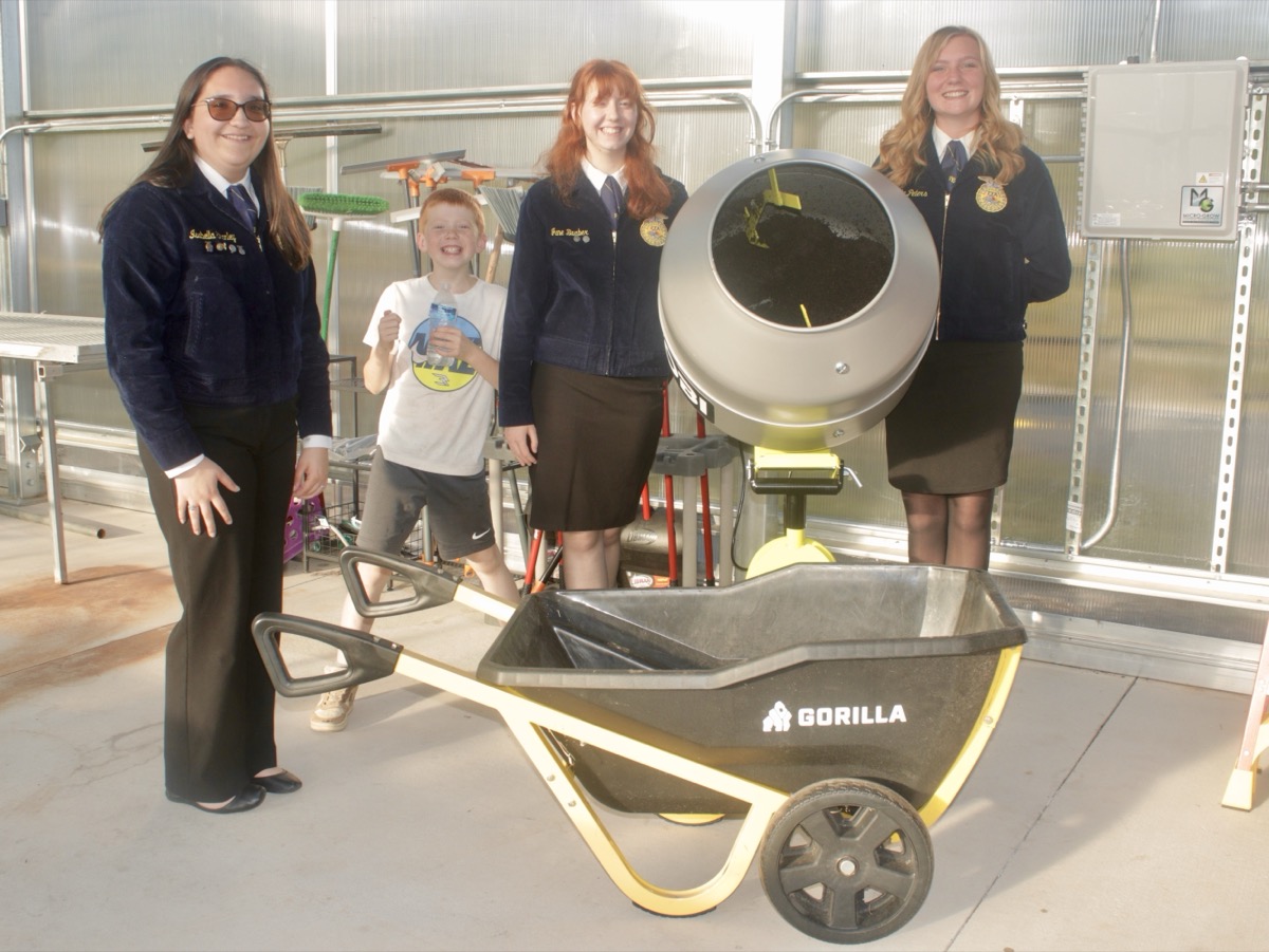 FFA students gave tours of their new greenhouse at the recent ribbon cutting, seen here showing off their new soil-mixing station where different soil compositions can be made for different plants. Photo by Brittany Holbrooks