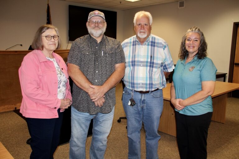 (L-) County Finance Director Kay Wilcox, Commissioner Harold Collins, Tax Commissioner Lee Knight and Deputy Tax Commissioner Jennifer Kerr. Photo by Shawn Jarrard