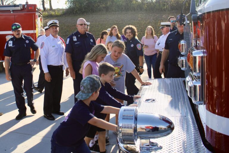 Young members of the community assisted Union County Firefighters with pushing in the new SPLOST-funded fire engine at Station 13 last Thursday. Photo by Lowell Nicholson