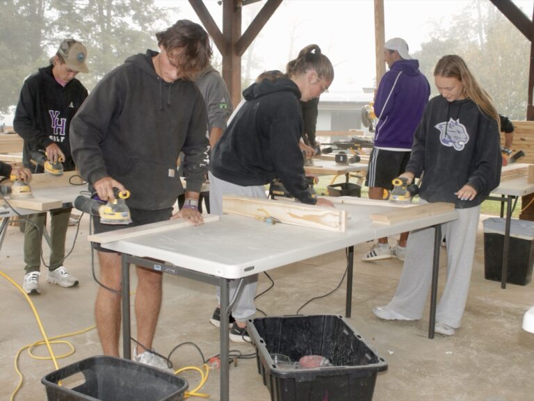 Young Harris College student athletes had a great time volunteering to build beds with Sleep in Heavenly Peace Oct. 8. Photo by Brittany Holbrooks