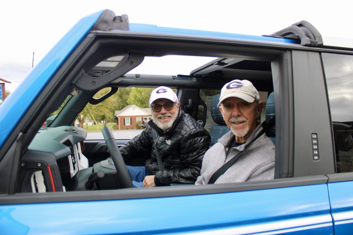 Local historian and longtime Union County ag agent Mickey Cummings served as Grand Marshal for the 2026 Sorghum in the Mountains Parade, pictured here with driver Tony Hamby in a vehicle supplied by King Ford. Photo by Lowell Nicholson