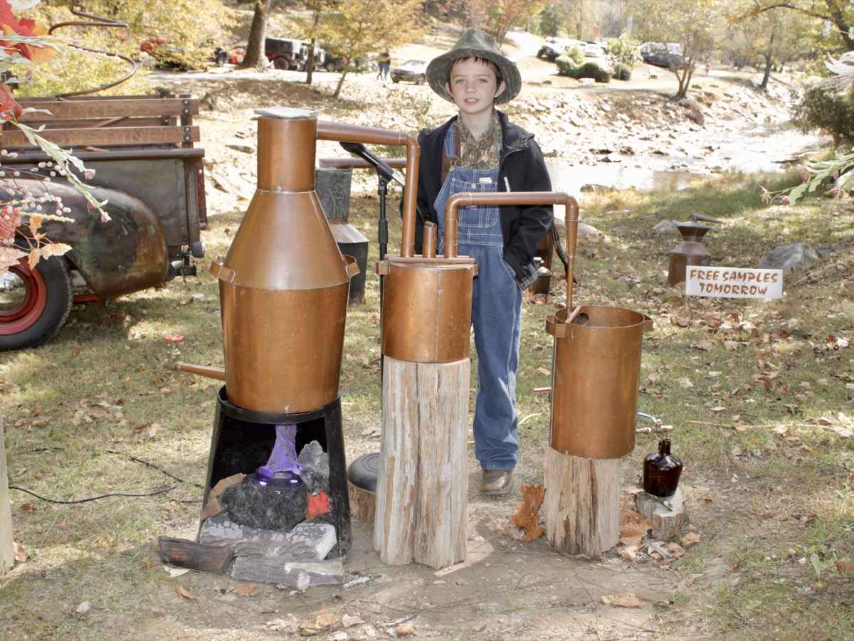 Tennessee White, 10, assisted Frank the Moonshiner’s Sorghum Festival demonstration with a historical presentation that was both educational and entertaining. Photo by Brittany Holbrooks